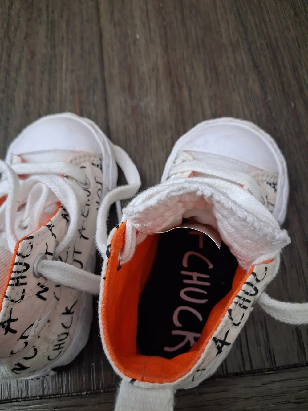 Converse Kids White Canvas High-Tops with Orange Interior and Black Script